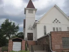 Lyons Community Church, a red sandstone church with a white steeple