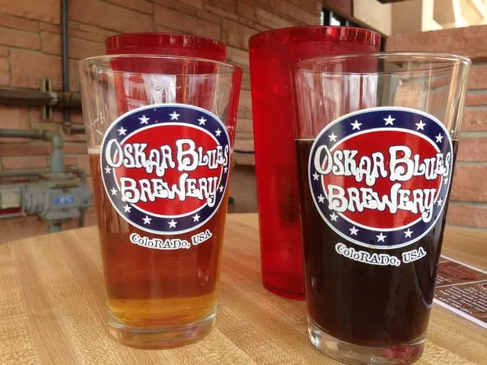 Pints of Oskar Blues beer on a table