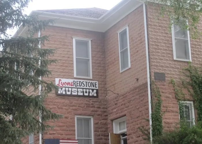 The rusticated red sandstone walls of the 1881 Lyons schoolhouse, now the Redstone Museum