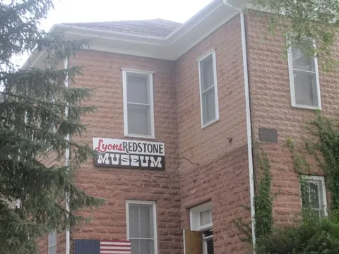 The rusticated red sandstone schoolhouse of 1881, now the Lyons Redstone Museum