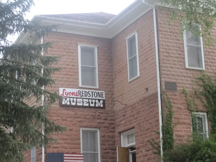 The rusticated red sandstone walls of the 1881 Lyons schoolhouse, now the Redstone Museum
