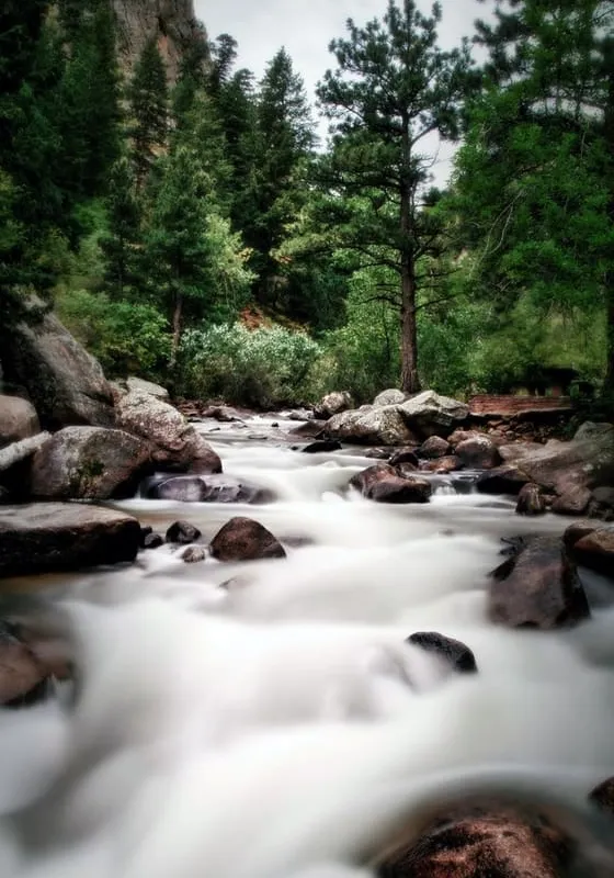 The North St. Vrain pouring white between red boulders in the canyon above Lyons