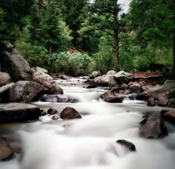 The North St. Vrain pouring white between red boulders in the canyon above Lyons